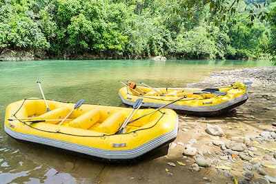 Team paddling together down rapids